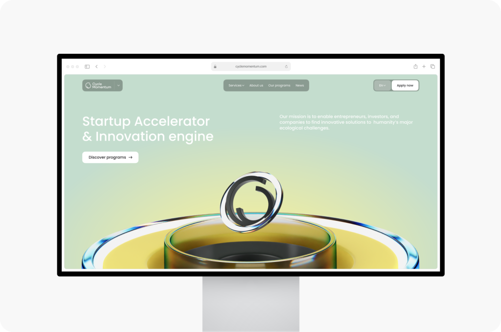 A monitor showcasing a webpage for a startup accelerator, designed by a leading website design agency in Ottawa. The website features a circular 3D graphic and buttons for discovering acceleration programs.