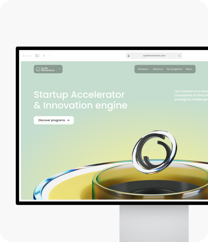 A monitor showcasing a webpage for a startup accelerator, designed by a leading website design agency in Ottawa. The website features a circular 3D graphic and buttons for discovering acceleration programs.